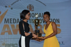 Ms. Shadae Foster recieves  award for  2018 Jamaica Young Scientist Competeition from then  Actg. Permanent Secretary Ms. Wakheen Murray.