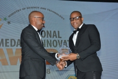 Mr. Aldain Reid,  Health and Safety Category winner receives award from Mr Lennox Channer, VP, Accounting- Jamaica Broilers.