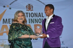 Mr. Christopher Dhering,   Entertainment Product Category winner receives award from Dr Maria Myers-Hamilton, Managing Director, Spectrum Management Authority.