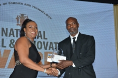Mr. Paul Jackson,  Agriculture, Food and Agro Processing Category winner receives award from Mrs. Lu'Shana Cheddesingh, Manager, Capacity Development, Develeopment Bank of Jamaica.